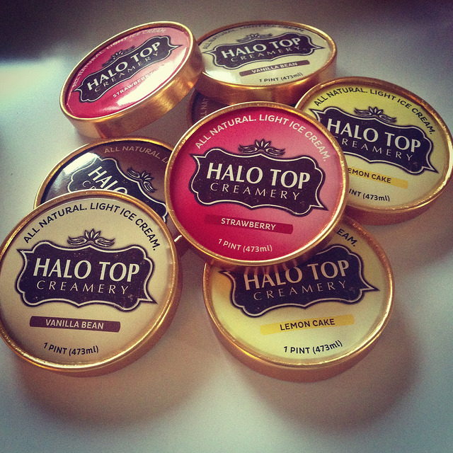 Seven halo top ice cream lids stacked on top of each other.