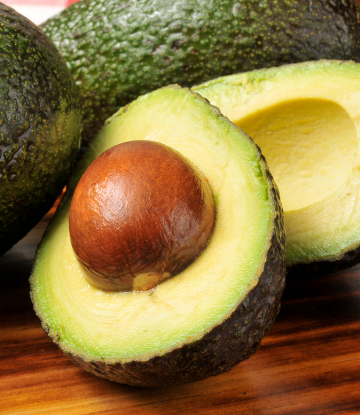 Supply Chain Scene, image of a fresh avocado sliced in half