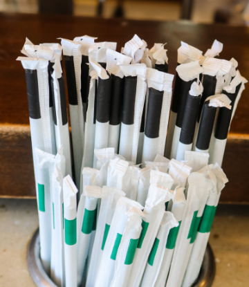 Supply Chain Scene, image of a cup full of paper wrapped drinking straws