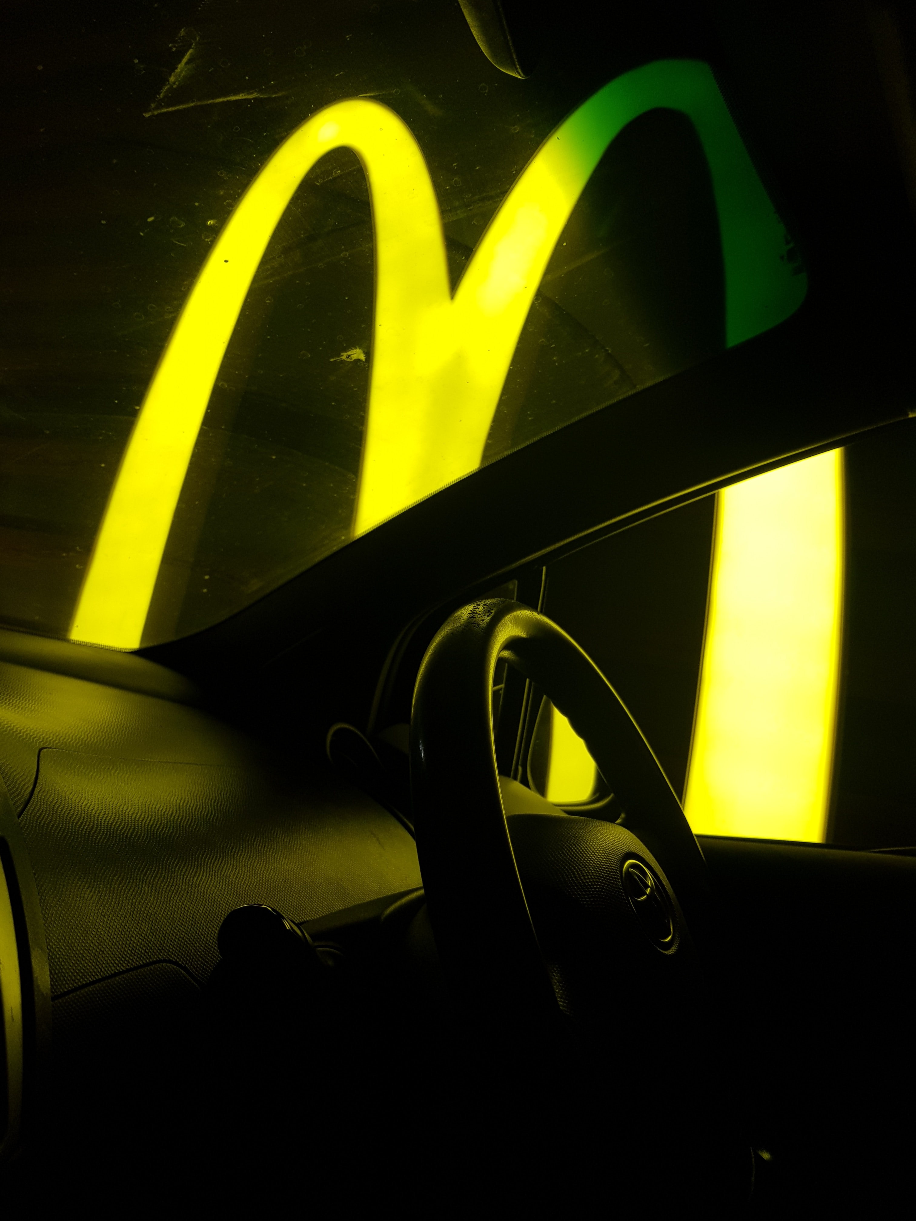 Supply Chain Scene, Image of McDonalds Golden Arches at night 