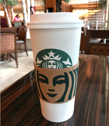 Supply Chain Scene, image of a Starbucks cup on a table 