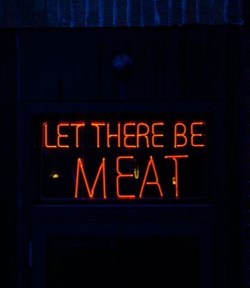Supply Chain Scene, sign that reads LET THERE BE MEAT 