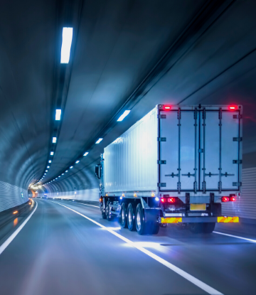 SCS, image of a large semi truck driving through a road tunnel 