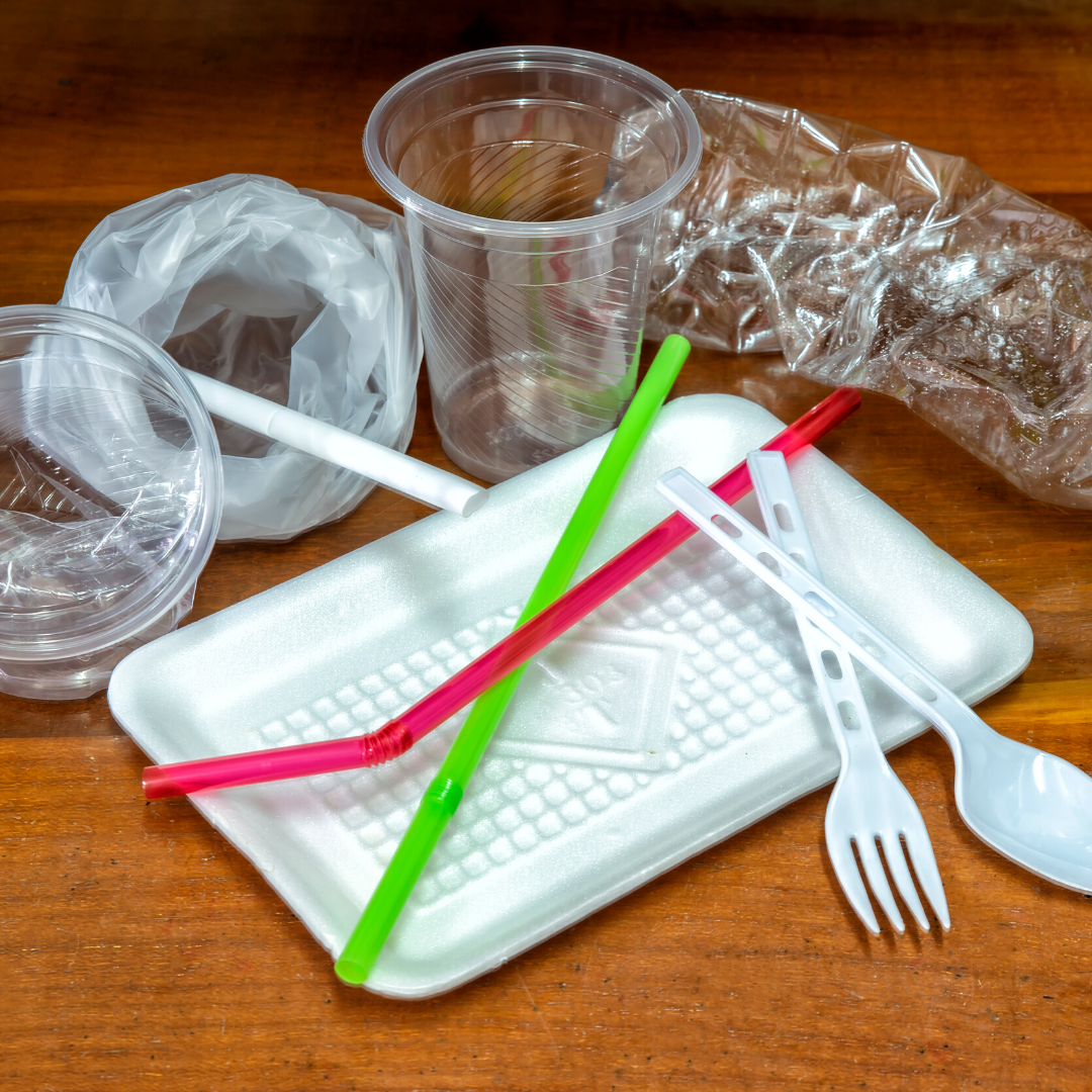 Immage of a variety of single use restaurant ware, cups, styrofoam, straws, sporks, plastic 