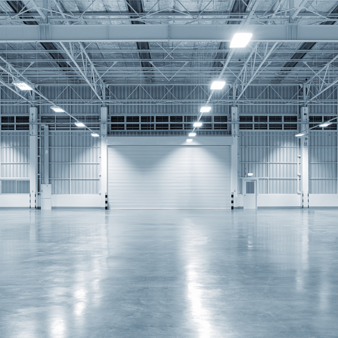 Interior image of a large, empty commercial warehouse 