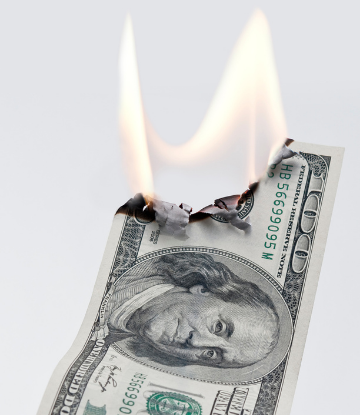Image of a $100 bill on fire 