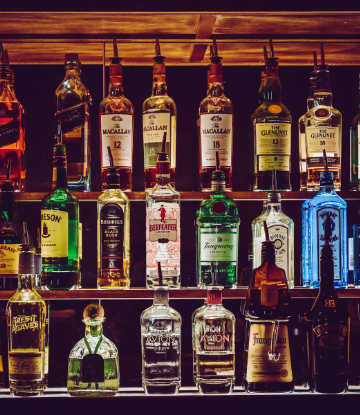 Image of a back bar filled with liquor bottles