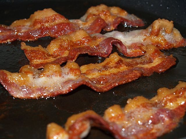 4 strips of sizzling bacon