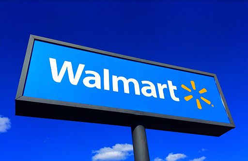 Walmart sign with blue sky background.