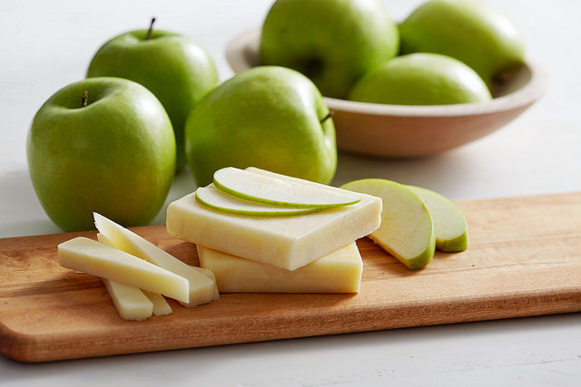 Image of apples and cheese on a cutting board