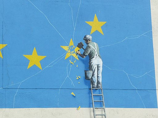 Banksy mural of main erasing EU stars (Brexit)