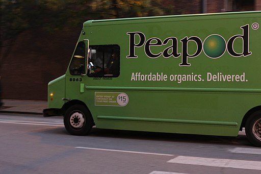Image of green Peapod grocery delivery truck