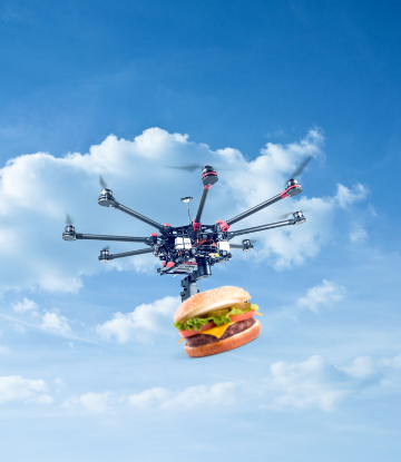 Supply Chain Scene, image of a drone carrying a cheeseburger 