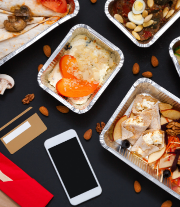 Supplly Chain Scene, image of delivery meals with an iphone 