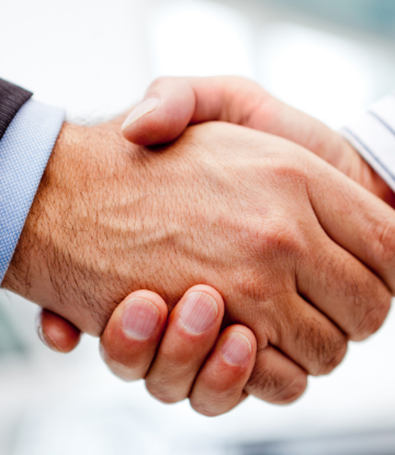 Supply Chain Scene, image of 2 business people shaking hands on a deal