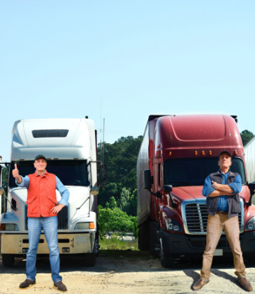 Supply Chain Scene, image of two drivers standing in front of large trucks 