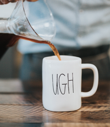 Supply Chain Scene, image of man pouring coffee in to a cup that reads "UGH". 