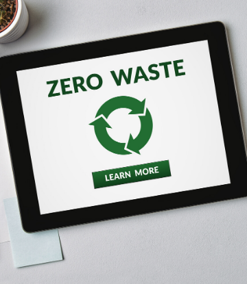 SCS, imge of an ipad with the words ZERO WASTE on it in green with the symbol for recycling 