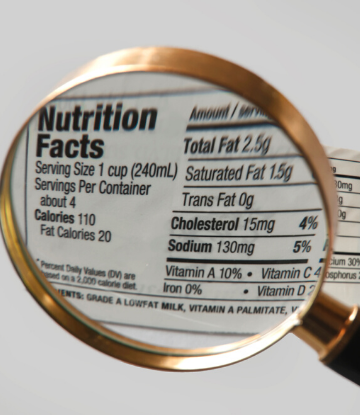 SCS, image of a magnifying glass against a food nutrition label 