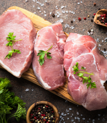 SCS, image of three seasoned raw pork chops 