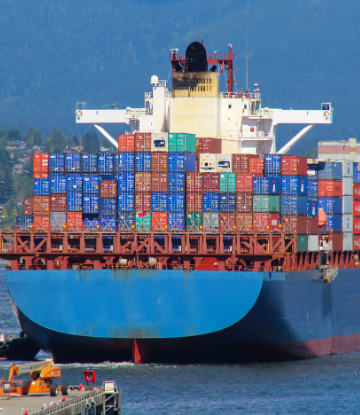 Image of a large container ship coming to port 