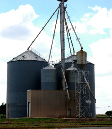 Image of grain storage bings on a farm 