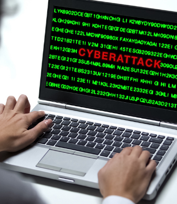 Image of a laptop with the word CYBERATTACK in red 