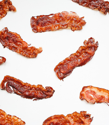 Image of an assortment of cooked bacon slices 