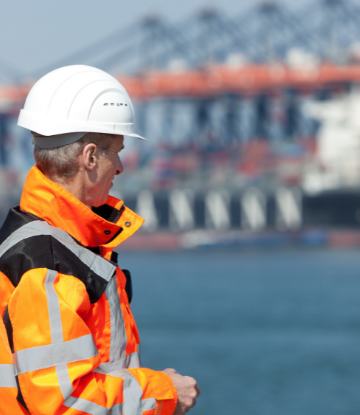dockworker in orange safety vest 