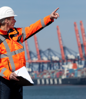 dockworker in orange safety vest
