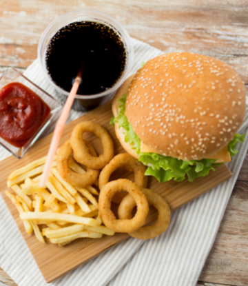 hamburgers, fries, onion rings and soft drink