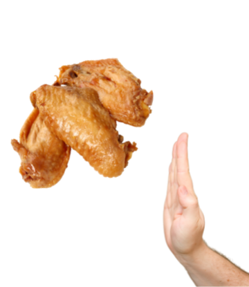 A hand saying no to cooked chicken wings 