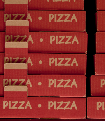 Stack of cardboard pizza boxes