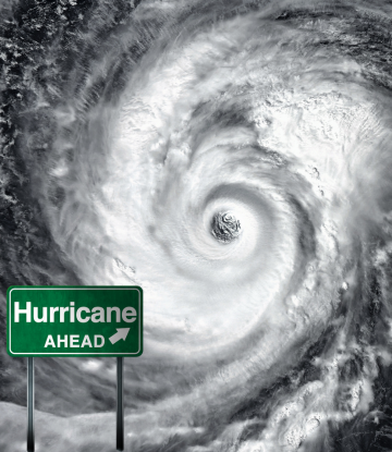 the eye of a hurricane with a green sign "hurricane ahead" 