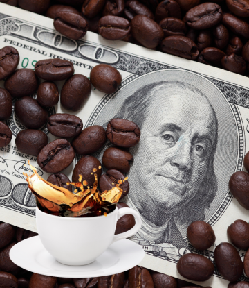 Coffee cup, beans and hundred dollar bill 