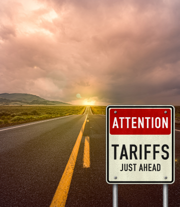 Tariff sign on a long road 